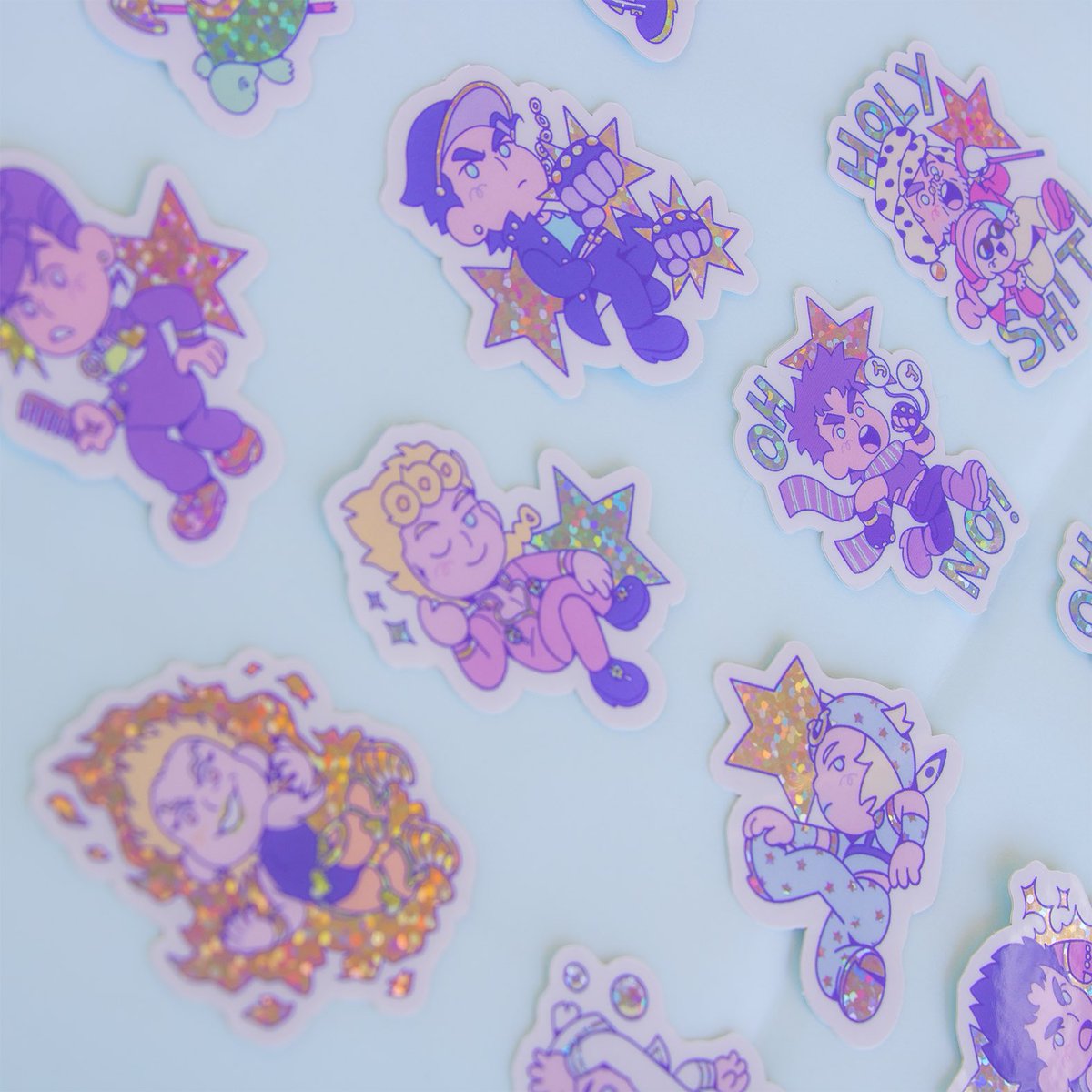 Oh no!!! All the Jojos turned into stickers! Could it be an attack from an enemy stand user? At least they look cool with all that glitter... 

One pack includes 12 glitter stickers, approximately 4x5 cm. 

They’re available on my Ko-fi shop!! ⭐️
ko-fi.com/ninarosa/shop