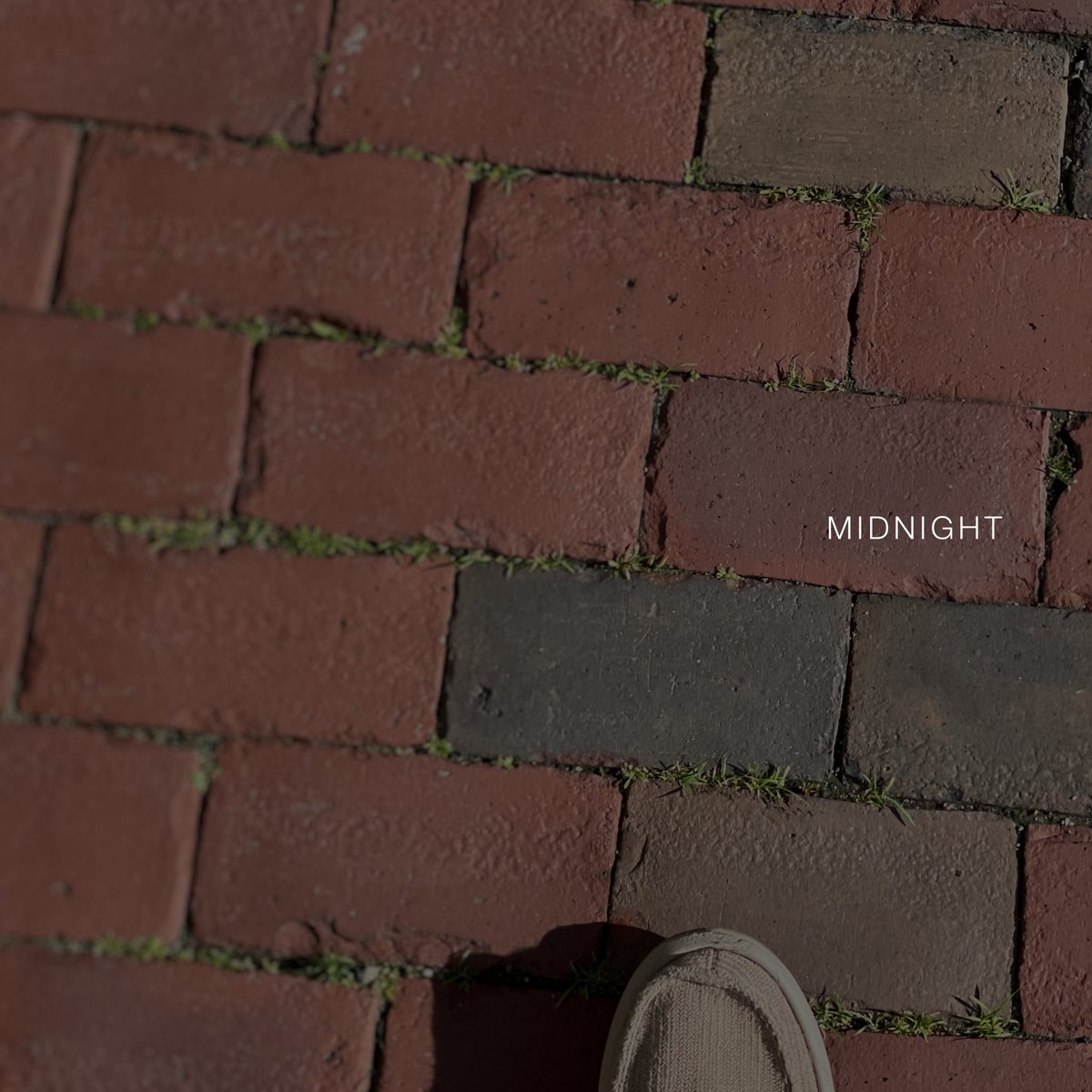 This image briefly appeared on chrisrudel.com. The photo was leaked early this morning. No such image can be found anywhere on the singer’s website. The image is notable because the only word on it is “MIDNIGHT” in a new font inconsistent with the current aesthetic.