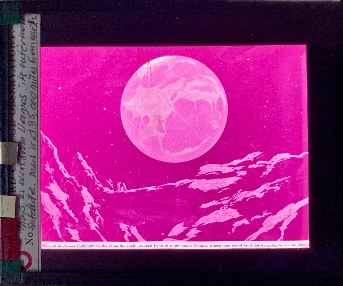 _GlassStars_'s tweet photo. This imaginative image of #mars seen from the surface of #deimos, comes from our collection of #lanternslides used for teaching in the first half of the 1900s. These #astronauts would have had a #wildride.
@usnatarchives
#ArchivesHashtagParty #ArchivesAmusementPark
#scifi https://t.co/jdZvq6AUvK