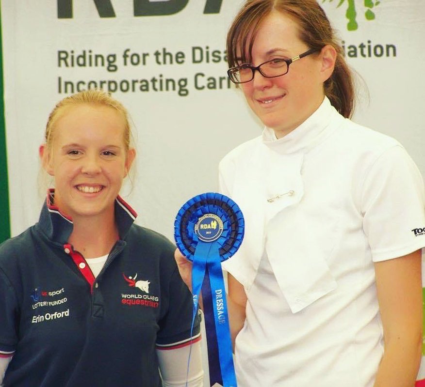 🐴 Former North Midlands Regional Chair, Clarissa and our Mascot <a href="/RDANomad/">Nomad</a> took a photo of them at Hartpury in 2018.

🏵 Christine Durrance, one of <a href="/MountGroupRDA/">The Mount Group RDA</a> participants receive the second place rosette from <a href="/EOrfordDressage/">Erin Orford</a> at the prizegiving in 2015.