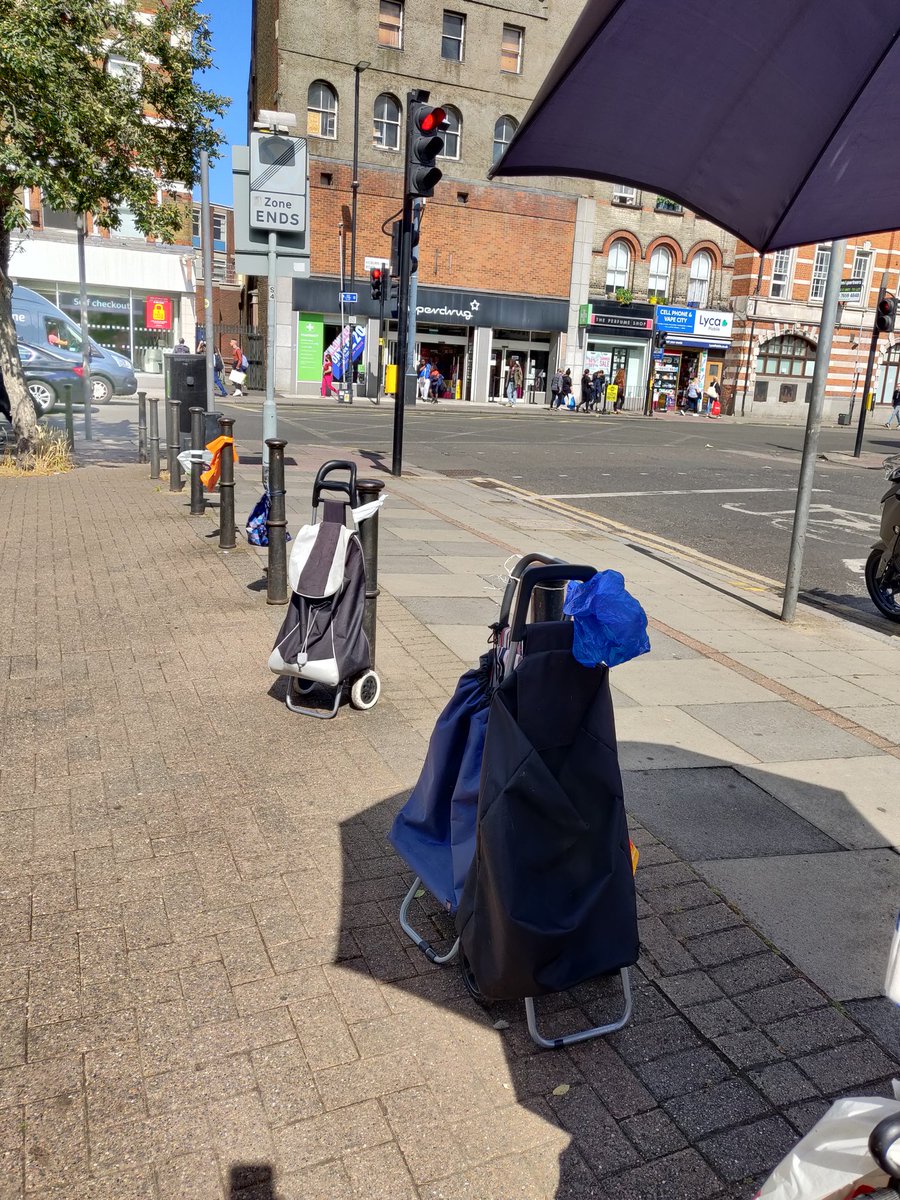 The now sadly usual row of waiting bags and trolleys in anticipation of @KilburnStreet tonight in Kilburn Square.
