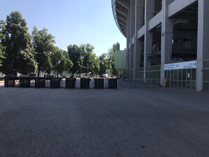 Photo of concert entrance gates outside stadium.