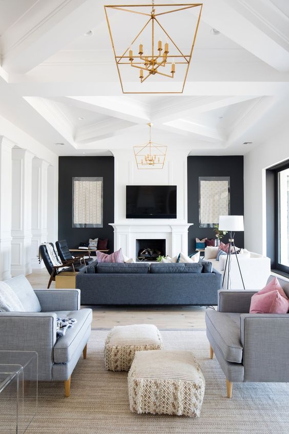 Don't know how to decorate a long room? Separate the space using rugs to make it feel like 2 distinct spaces. A conversation space plus an office or tv watching space is great for these long layouts!
#interiordesign #staging