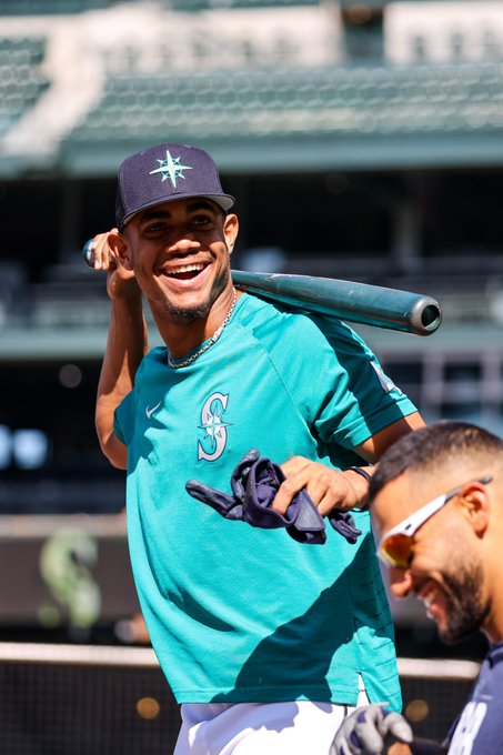 Julio Rodríguez smiling during batting practice.