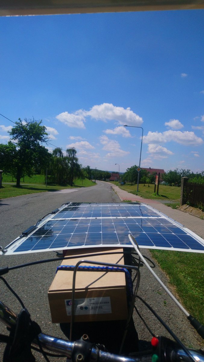 ArachneLabs's tweet photo. Lenochod 1.2 after upgrades at Dohalice forge. This is the possible #solarbike layout, with lot of shade for both my head and legs, battery and motor. The front view is excellent, while I also directly see where my front wheel goes... https://t.co/B8bd6iWzWs