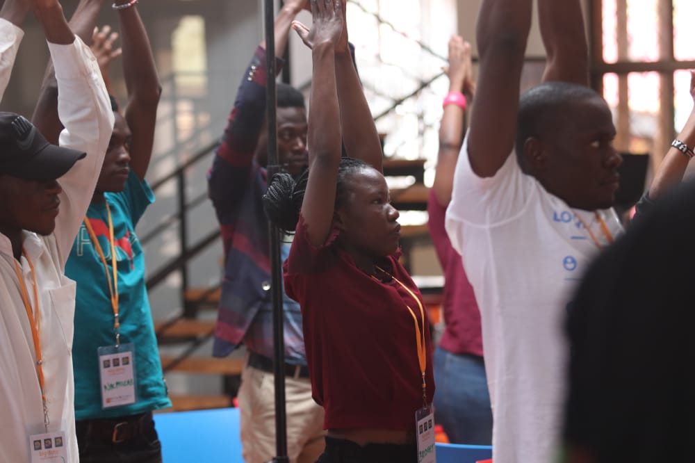 SourceCode_Ltd's tweet photo. This was the Best part of  the Datafest,After a heavy lunch,these stretches just made us more active @PollicyOrg @TheVillageUG  #DFA22 #Datafestkampala https://t.co/GwRWZXK7j5