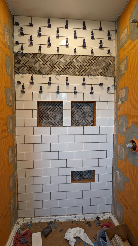 Done for the day. Had enough thinset to do the niches. Tricky cutting the tiles to fit (and one pattern mistake I won't point out), but overall I'm happy. What do you think @linuxhiker?