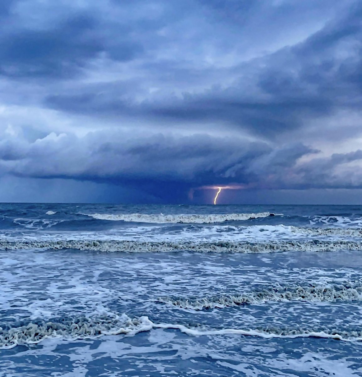The only exciting thing about #Colin? An offshore storm with a cool rain shaft and bolt of lightning. Great shot from Pawleys Island via Ellie Gore. #scwx #ncwx