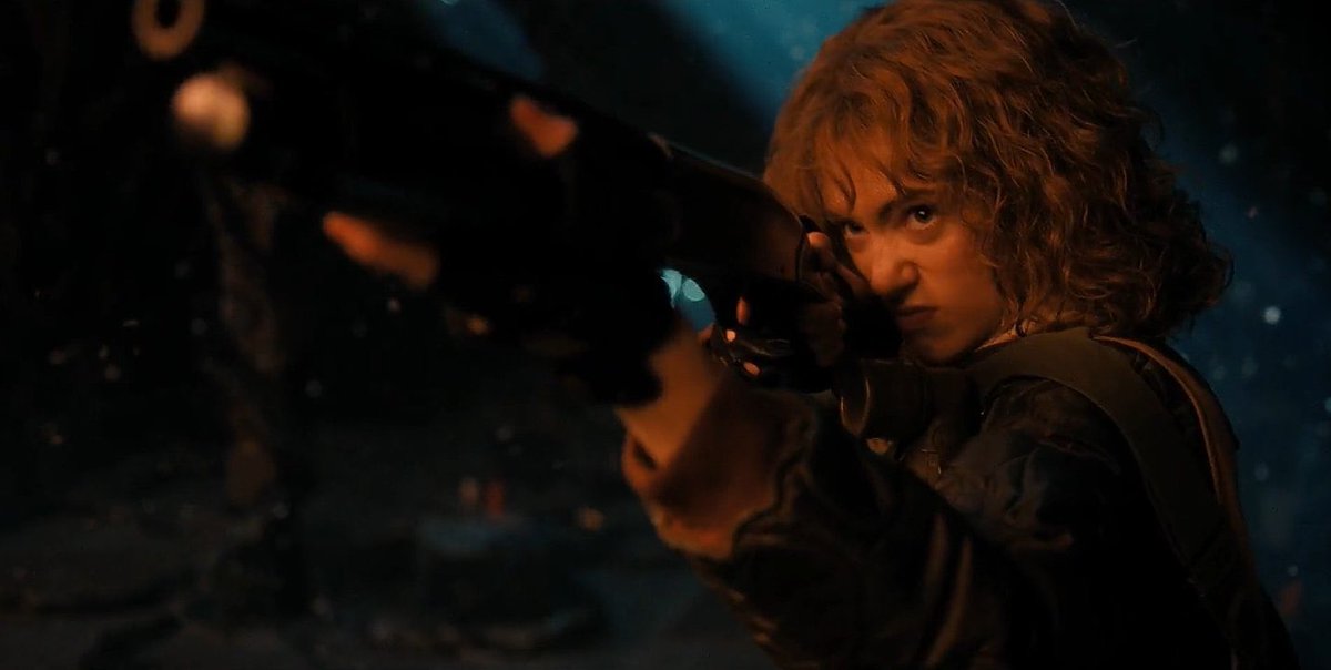 thinkernancyw's tweet image. 5 words: Nancy Wheeler with a gun