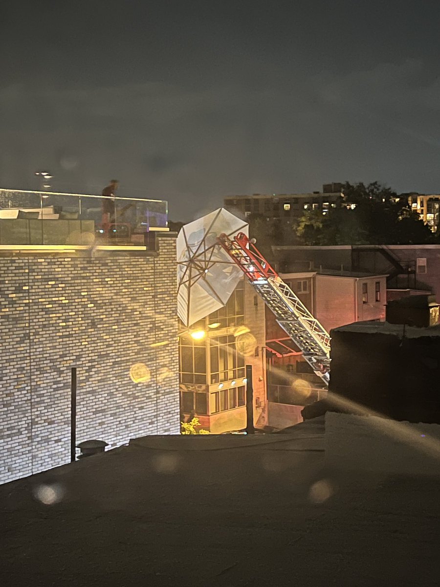 ncmart's tweet photo. True story: @dcfireems currently rescuing the umbrella that blew off my neighbors rooftop townhouse pool deck. Been like an hour. Every seems fine, except the umbrella. #dc #dcthings Cc @PoPville https://t.co/U1o80wRXHp