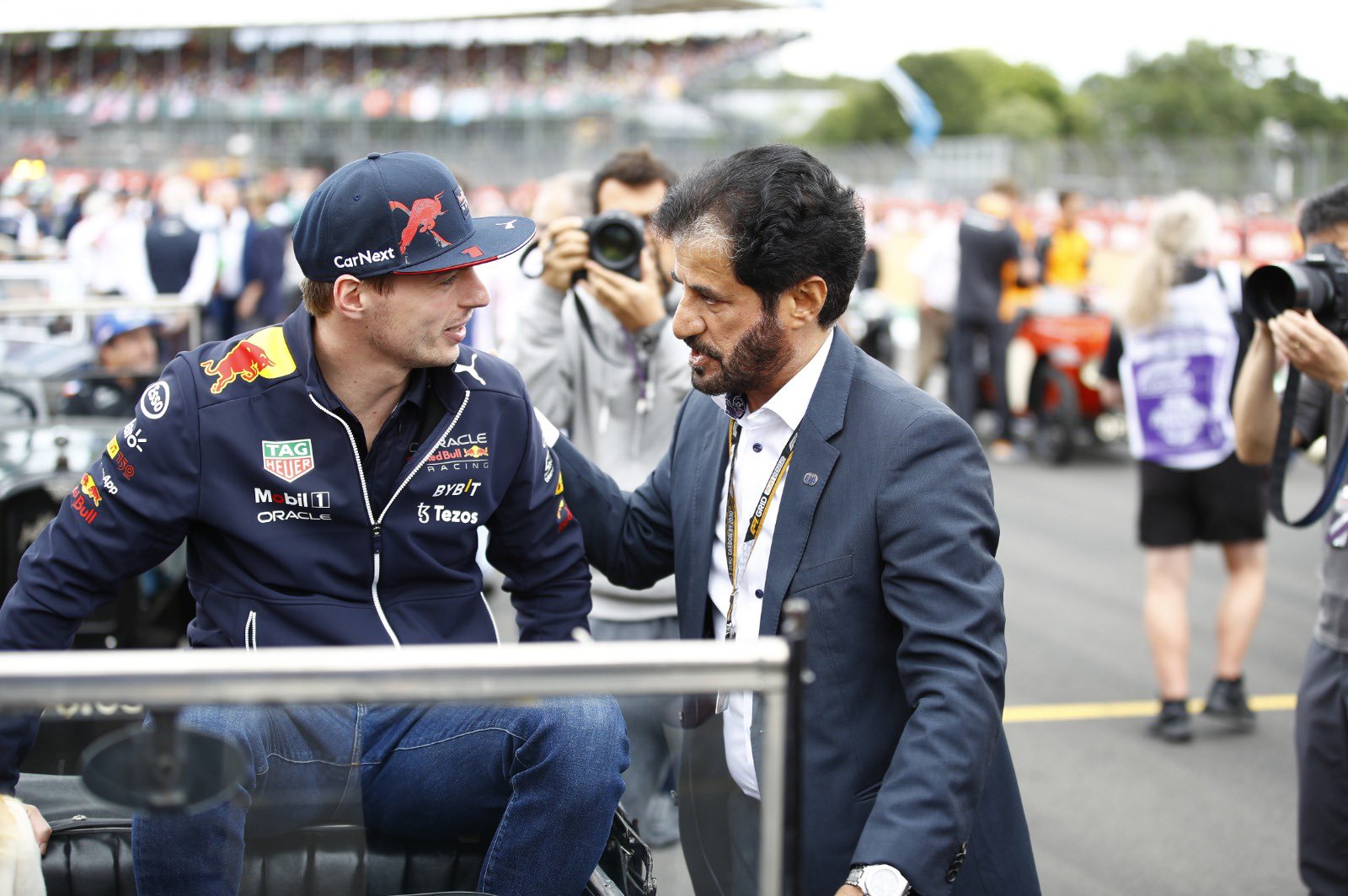 FIA President Mohammed Ben Sulayem with reigning world champion Red Bull driver Max Verstappen. It is the FIA the enforce the cost cap.