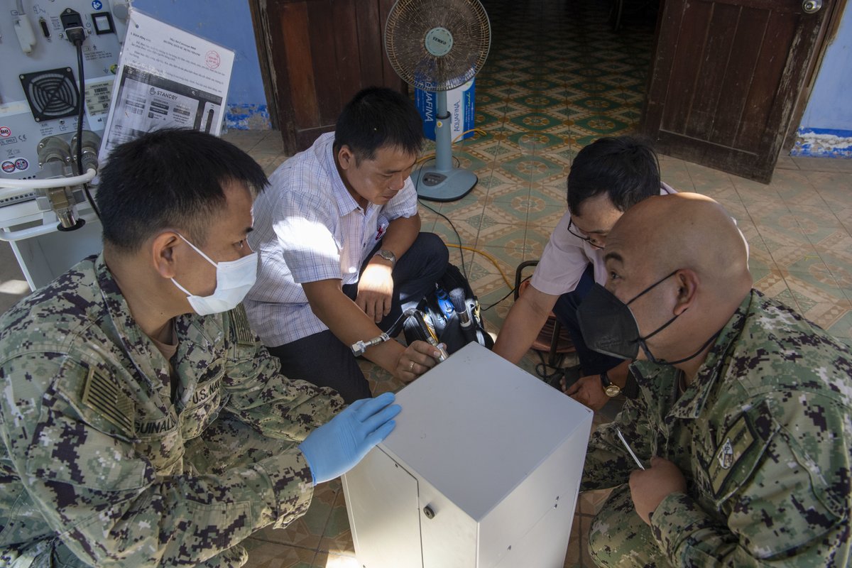 NavyMedicine's tweet photo. HM1 Glenn Soriano, HM1 Anthony Aguinaldo, and Vietnamese Tech Tien Huynh, from the Department of Material and Equipment Supplying, performed maintenance on a ventilator at Phu Yen Obstetrics & Pediatrics Hospital during Pacific Partnership 2022. #navymedicine #hospitalcorps #PP22 https://t.co/B1P44NjuLz