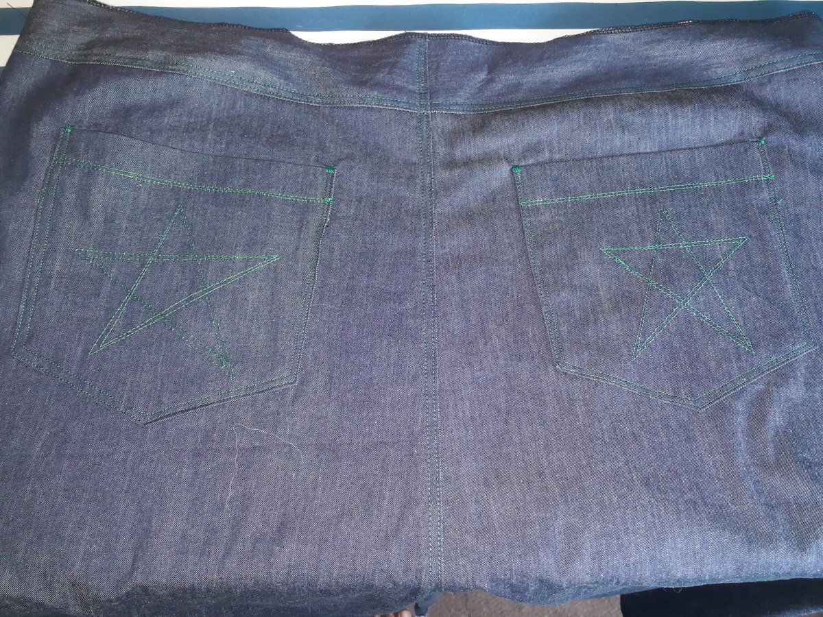 Freyalyn's tweet photo. Green stitched #stars on the back pockets of the jeans-skirt I'm #sewing during today's #FairyCon. https://t.co/1obYjlSgiz