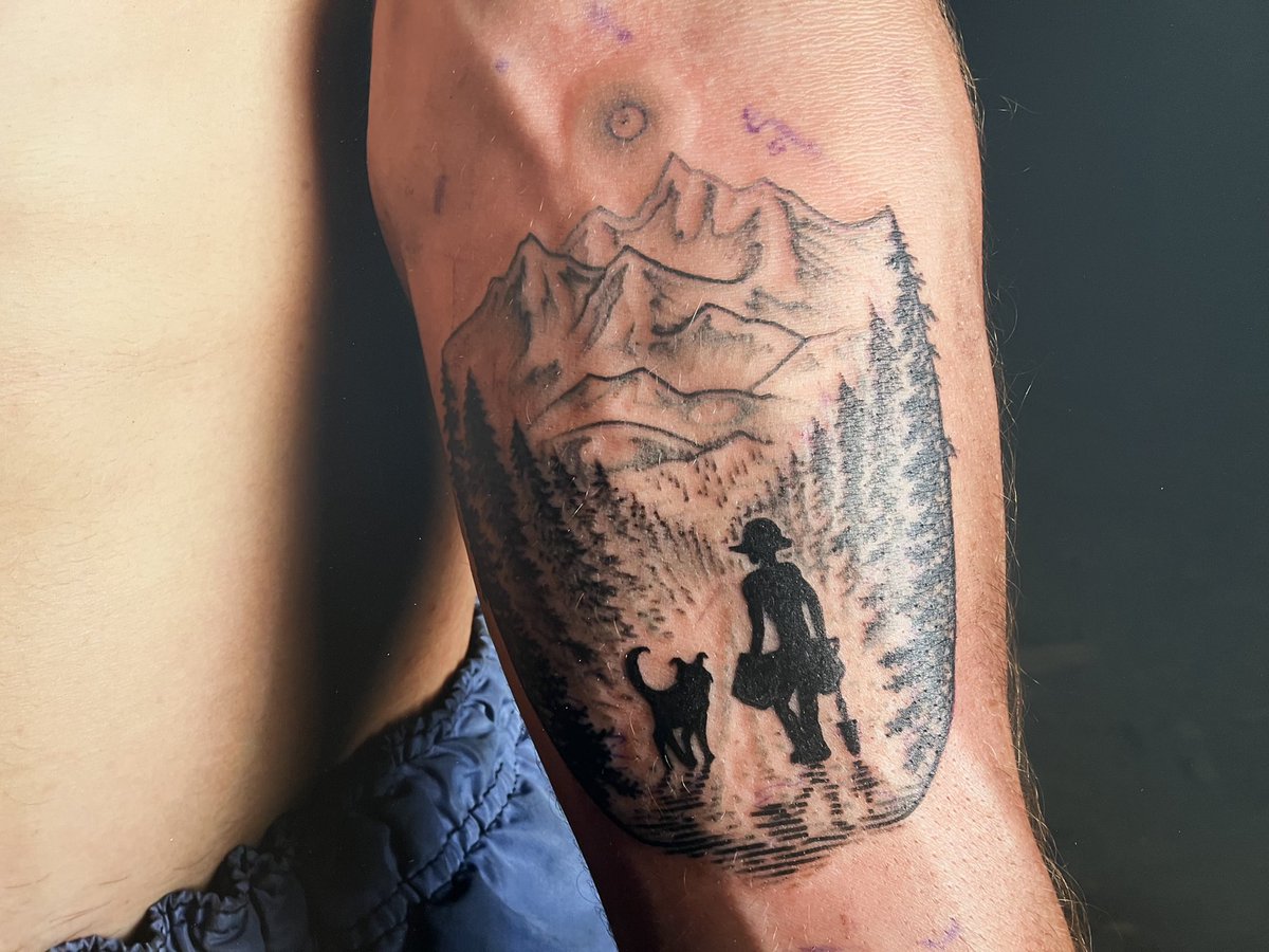 fftt_earth's tweet photo. Pictured is a detail of “Evan’s tattoo of Earnest and Evan,” 40x54 inches in  THE TREE PLANTERS. Laurence Morin gave Evan this tattoo in 2018, as a celebration of his friendship with his dog — a mainstay of camp, and a joy at work. Earnest died suddenly, on the block, in 2019. https://t.co/tJJSumVTH8