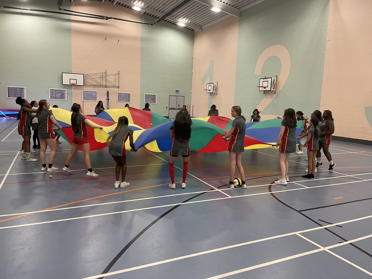 Year 9s creating a cool breeze with the parachute- lovely on a hot day!