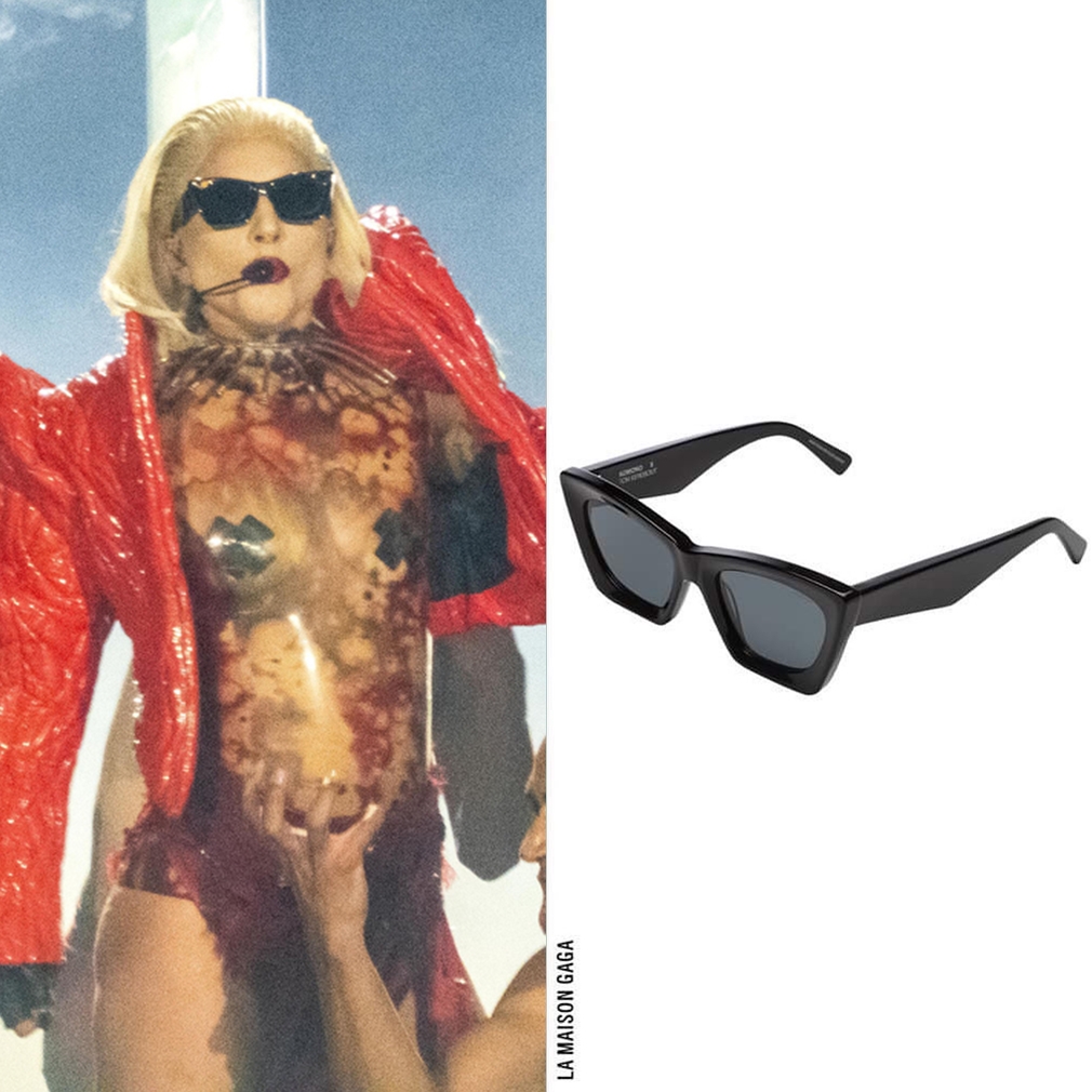 On the German stage, Gaga repped a German designer! Her red quilted puff shoulder jacket is from Berlin-based emerging designer #AZIZ, which she combined with the @Komono x @TomEerebout 'M Raven' sunglasses.