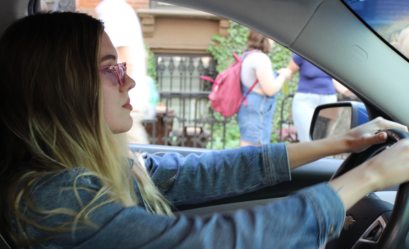 Reductress's tweet photo. Woman Looks Cool at Red Light Just in Case She’s Perceived: https://t.co/NAAHj6kvlP https://t.co/V5mr6G6B31