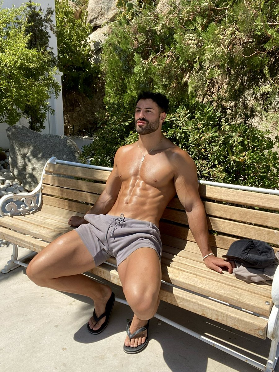 A close up of a woman in a seductive pose with her tongue out