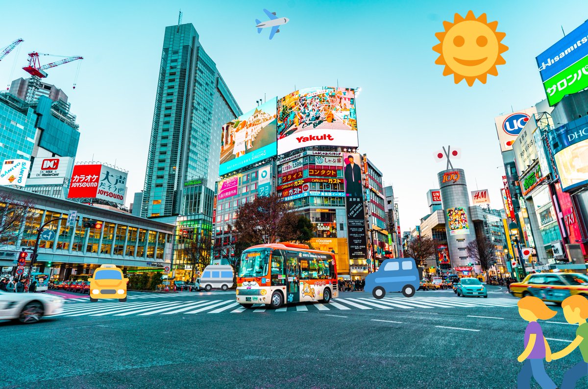 The crosswalk at Shibuya, Tokyo in Japan. A bus is crossing the intersection.