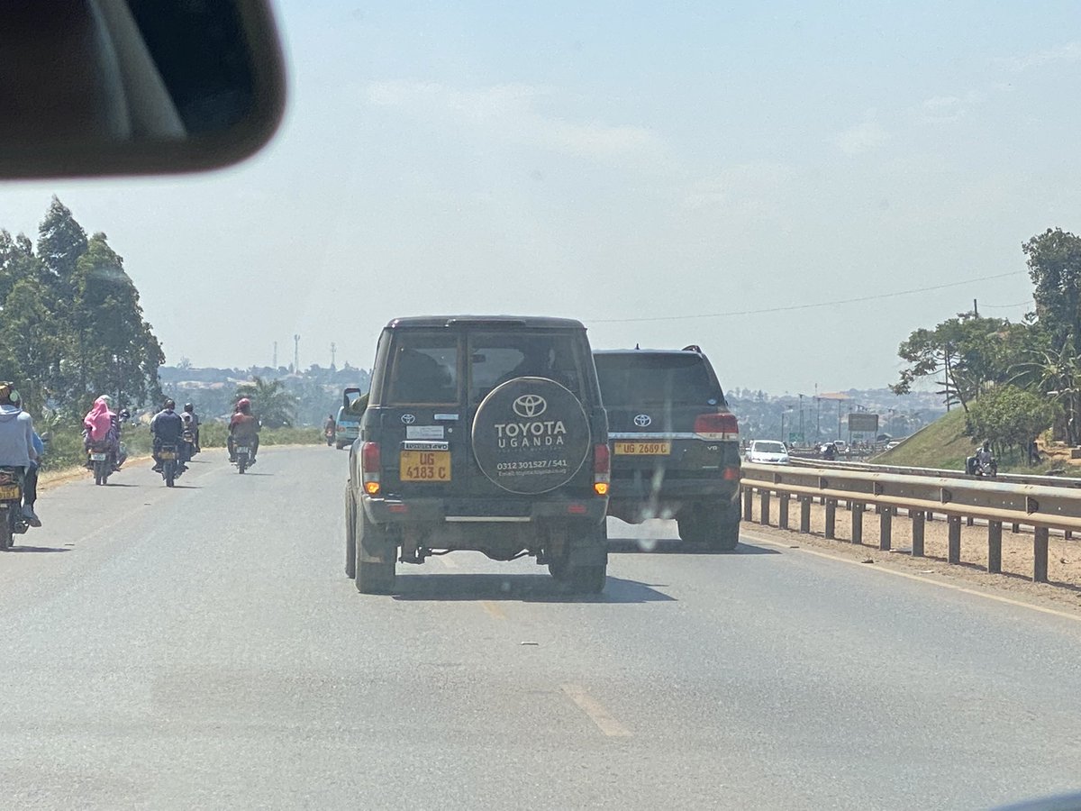 SpireJim's tweet photo. On Thursday, I was driving behind these two cars (UG 4183C &amp;
UG2689C) on Entebbe Express Highway). They moved very slowly all the way, blocking both lanes - with a soldier pushing out his hand to warn me not to overtake them. After paying to use the road! https://t.co/x4CTDNDvhV
