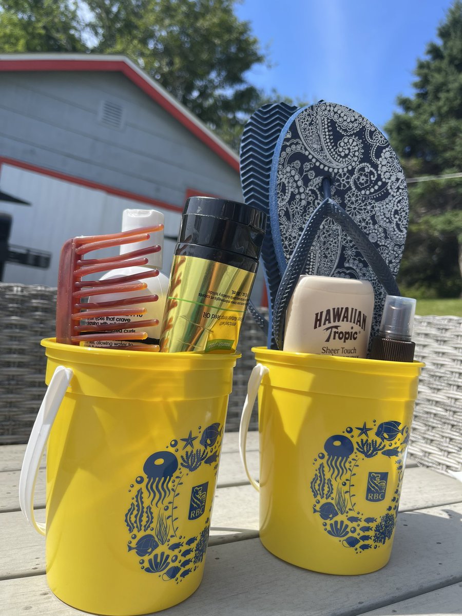 I took my boys to open bank accounts last week and they received these little beach buckets.  They are perfect for holding a small selection of beach supplies that we keep handy for lake days, like today!