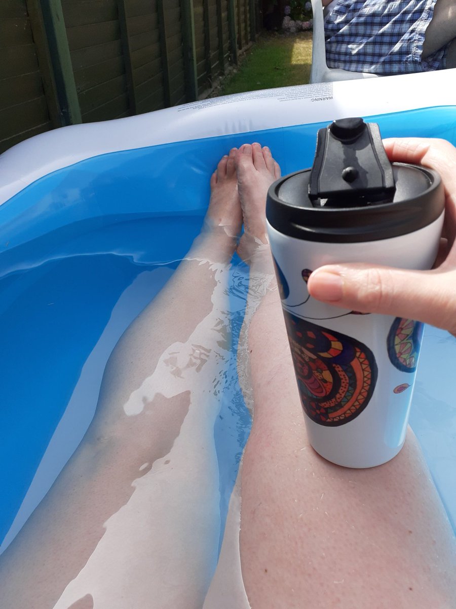 Sunday afternoon in the paddling pool with a gin cocktail in my thermal cup.