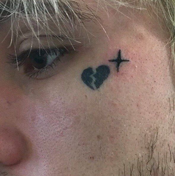 little broken heart tattoo on side of faceTikTok Search