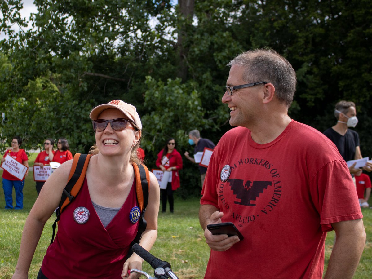 EmCeeAndyT's tweet photo. That's right, when @phil_christman isn't marching with the Nurses in Solidarity, he's an author of phenomenal essays! I have two of his books at home &amp; they're great!

Here's a pic I took of Phil &amp; @cindeegiffen at yesterday's #umpncPicket 

#LEOGLAM @LEOUnionUmich @umpncStrong https://t.co/eOcrTqN8sM