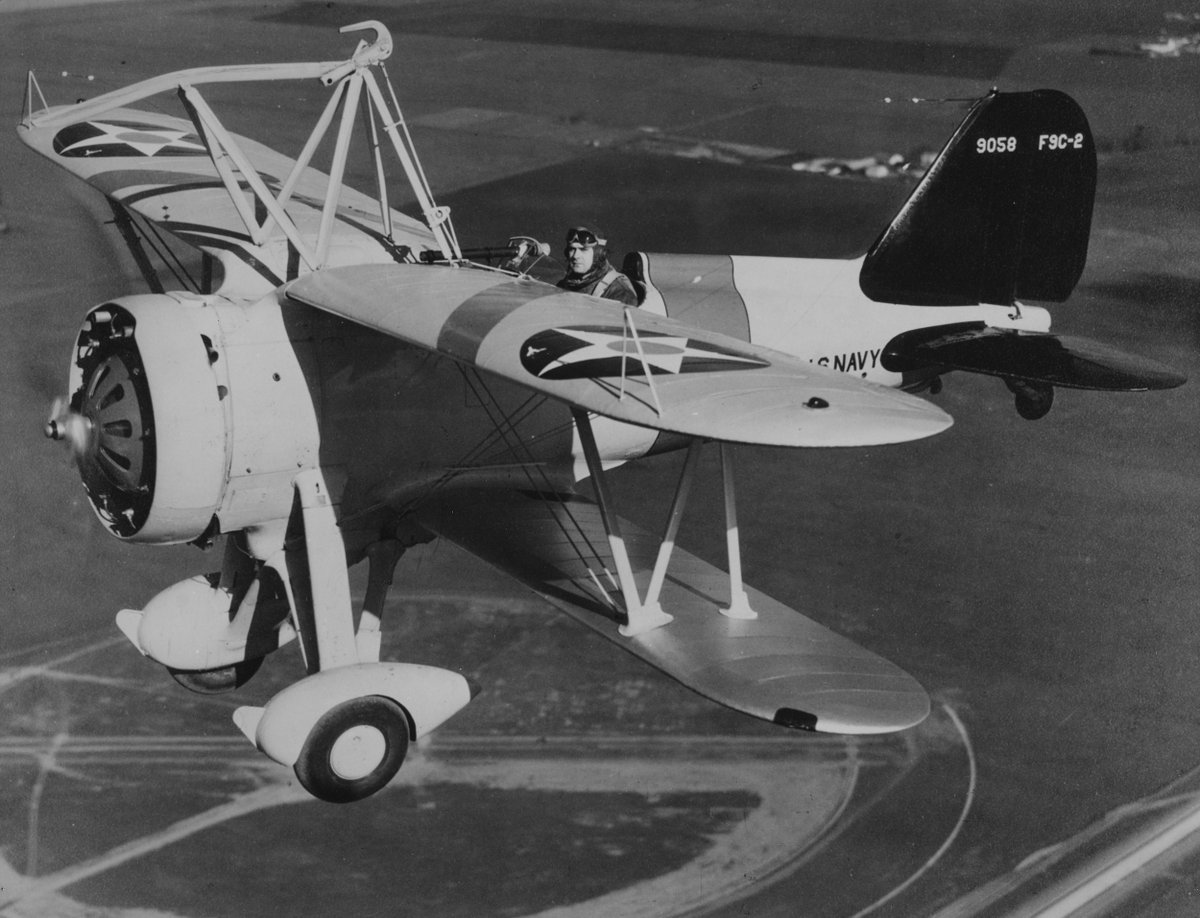 NavalInstitute's tweet photo. U.S. Naval Institute Archive Photo of the Week: A Curtiss F9C-2 Sparrowhawk fighter, piloted by Lieutenant Harold B. Min Miller, flying over Naval Air Station Moffett Field, California, in 1934. This plane was then assigned to USS Macon (ZRS-5). https://t.co/FtEHmd0bHc