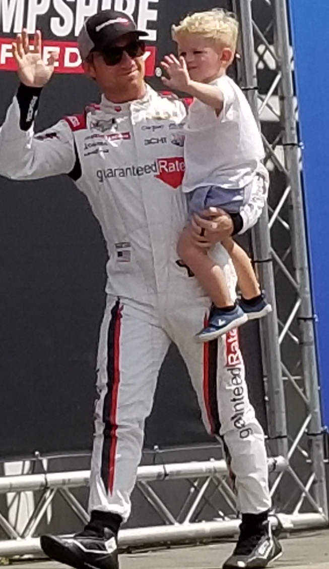 ClaireBLang's tweet photo. @TylerReddick #DriverIntros @NHMS - Son Beau has got the wave down! He starts 13th - Race Broadcast now - @SiriusXMNASCAR Post Race Show after, then #DialedIn until 10 p.m. ET https://t.co/wwUJJkjeQH