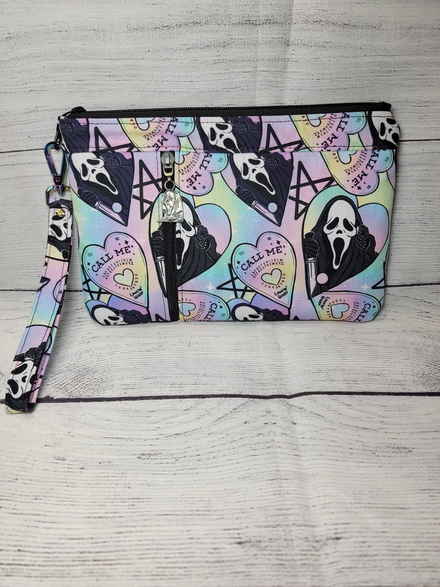 Zericon's tweet photo. Excited to share the latest addition to my #etsy shop: Ghostface inspired pastel rainbow zippy clutch wristlet https://t.co/3nOlJU6nED #rainbow #ghostface #scream #horror #halloween #zippyclutch #wristlet #pastel #callme https://t.co/S7SJu55Kg7