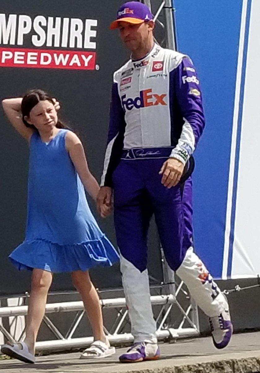 ClaireBLang's tweet photo. @DennyHamlin walks with daugher Taylor across the Vic Lane stage at driver intros - she is such a poised, kind and super cool little girl. When I see her I love hearing her take. Here, Taylor escorts dad who will start 14th! #BeatReporter @SiriusXMNASCAR https://t.co/t1h2FixhOG