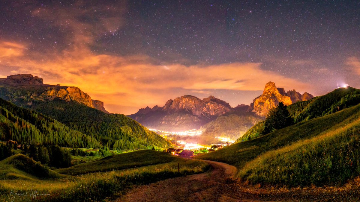 Two photos from the same location, taken near my hotel on Corvara, Italy. Just tue opposite direction! One shows a super clear night sky, the other a light polluted valley. Clash of contrasts in the Dolomites.