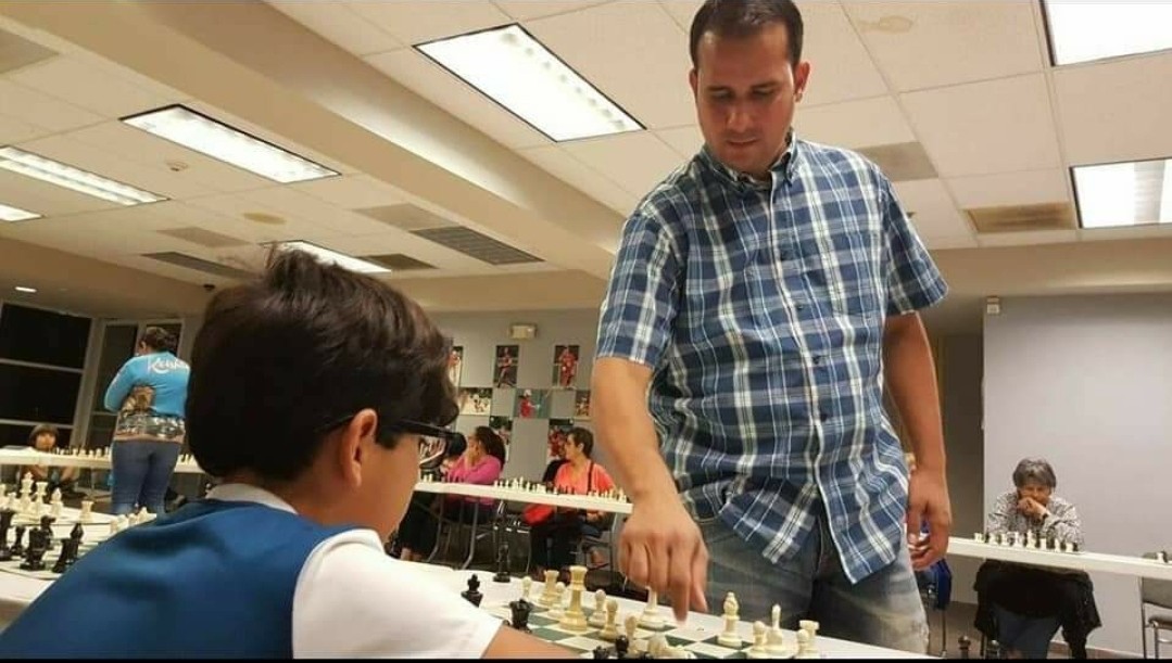 CBP's tweet photo. #ICYMI This week's #CBPeople: CBP Officer Francisco Cruz volunteers in his local chess club in Puerto Rico. Becoming a Chess Champion at 11 years old and inspired by his two children, Officer Cruz teaches chess, organizes tournaments, and impacts players of all ages. https://t.co/cND95fbdPW
