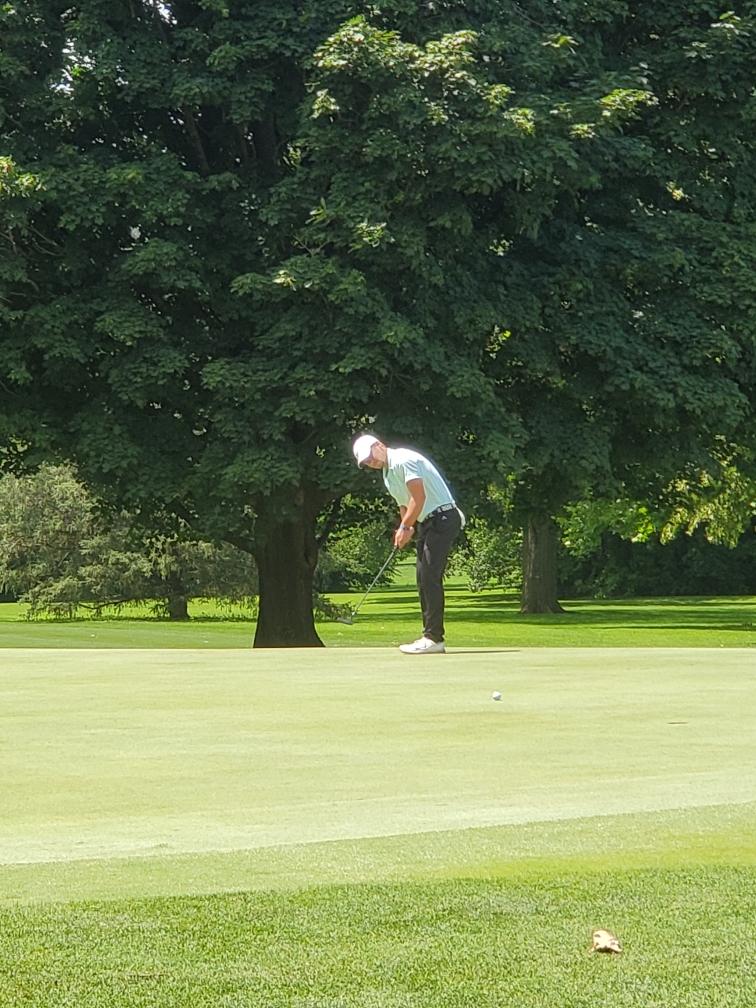 Chris C makes par on hole 17.