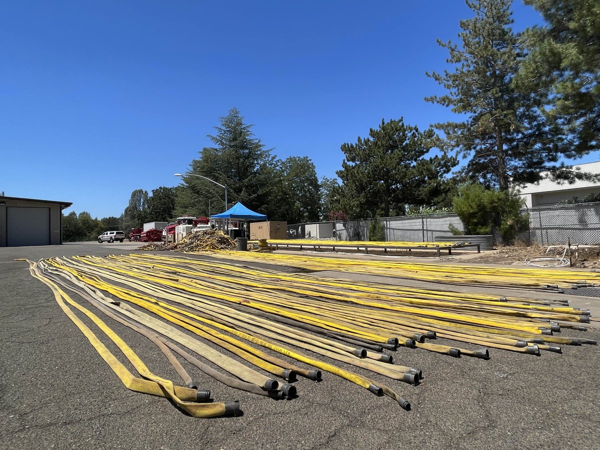 Hose and portable water tanks used by firefighters on the #PeterFire are getting washed, dried, and ready for whenever they may be needed next. #CALFIRESHU2022 #ReadyForWildfire