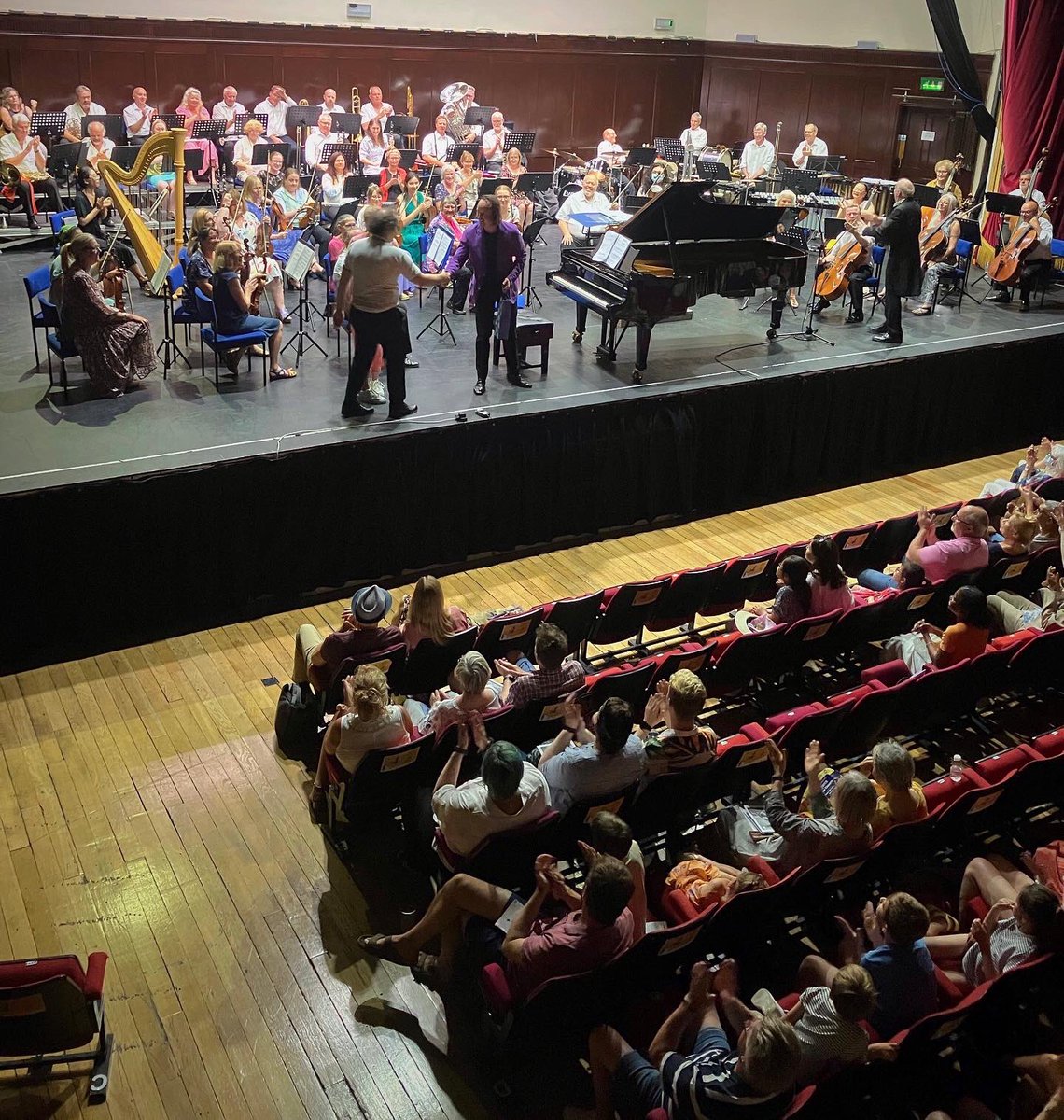 Soloist <a href="/OliverRPoole/">Oliver Poole</a> congratulates composer Simon Proctor after giving an electrifying performance of his Queen Piano Concerto with the <a href="/HastSinf/">Hastings Sinfonia</a> at <a href="/The_White_Rock/">White Rock Theatre</a>