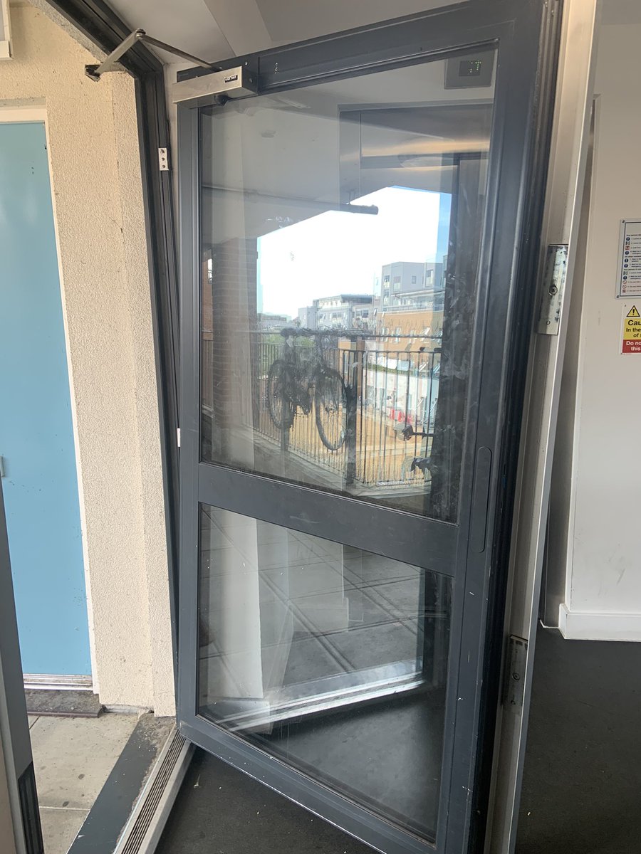 LenaWeberReed's tweet photo. @helloPeabody reported this last week, was told would be emergency repair. Nothing. It’s a heavy glass fire door literally hanging off its frame. Does someone need to get injured before you do anything? https://t.co/3GHLVkE4c9