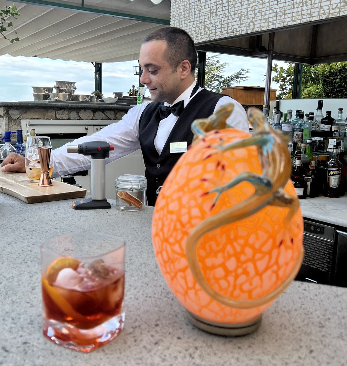 Crazy coincidence?  12 years ago I stayed at a sick hotel in Ravello, Italy. I drank a Negroni every day. 

So I took Anthony & the crew there and ordered a Negroni…and it was the same bartender!! 

2010 vs 2022 @PalazzoAvino
