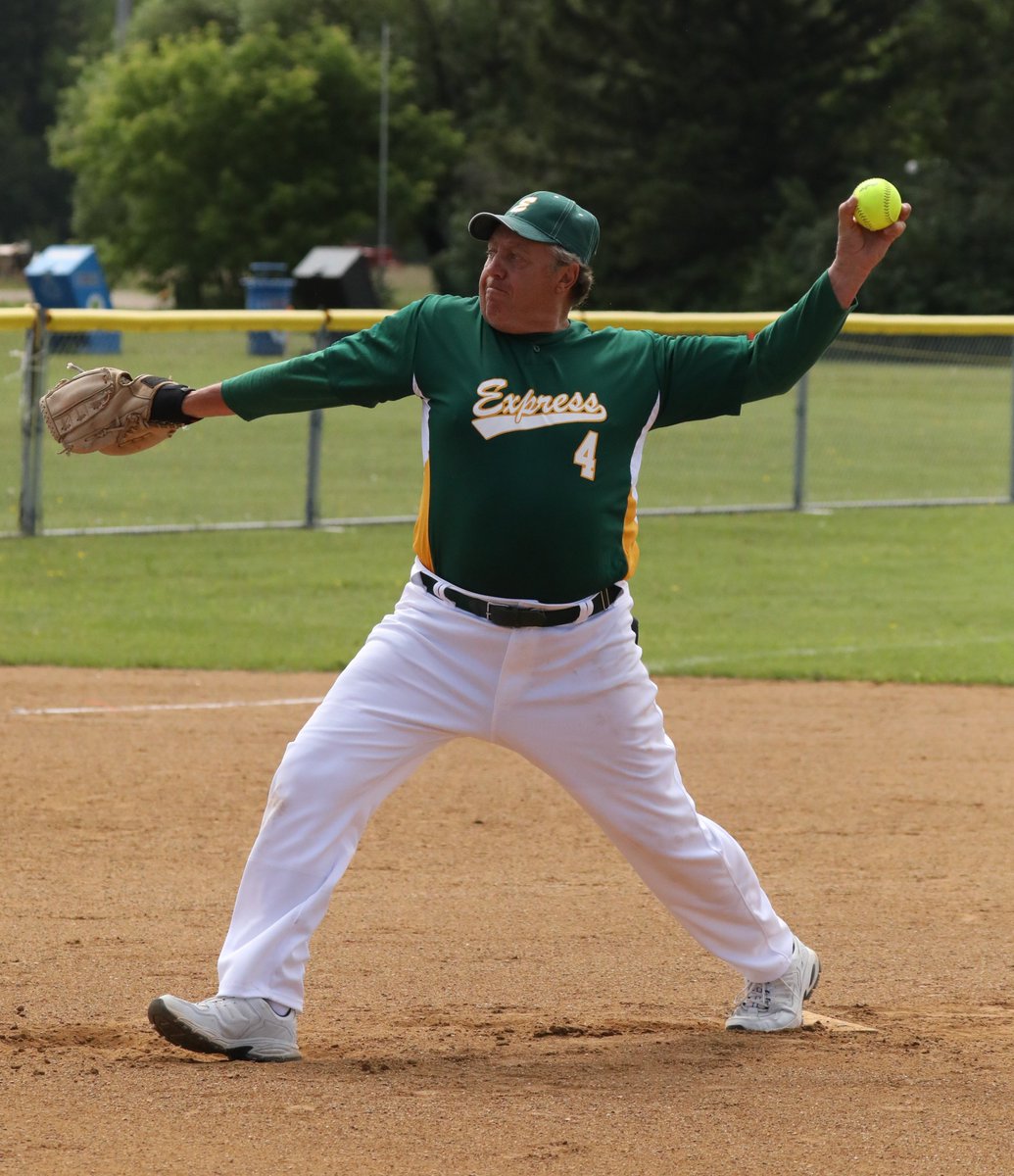 More game action from the Express vs Legends game, Clayton White of the Legends at the plate and Reg Clausson of the Express delivers a pitch