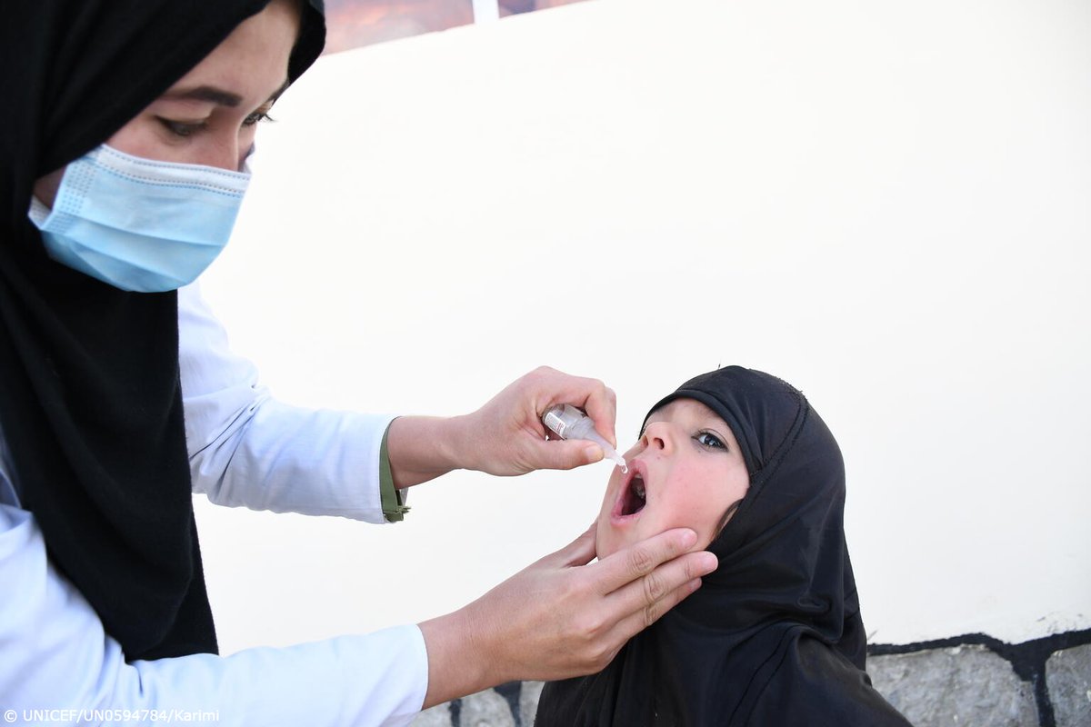 A young girl is vaccinated against polio