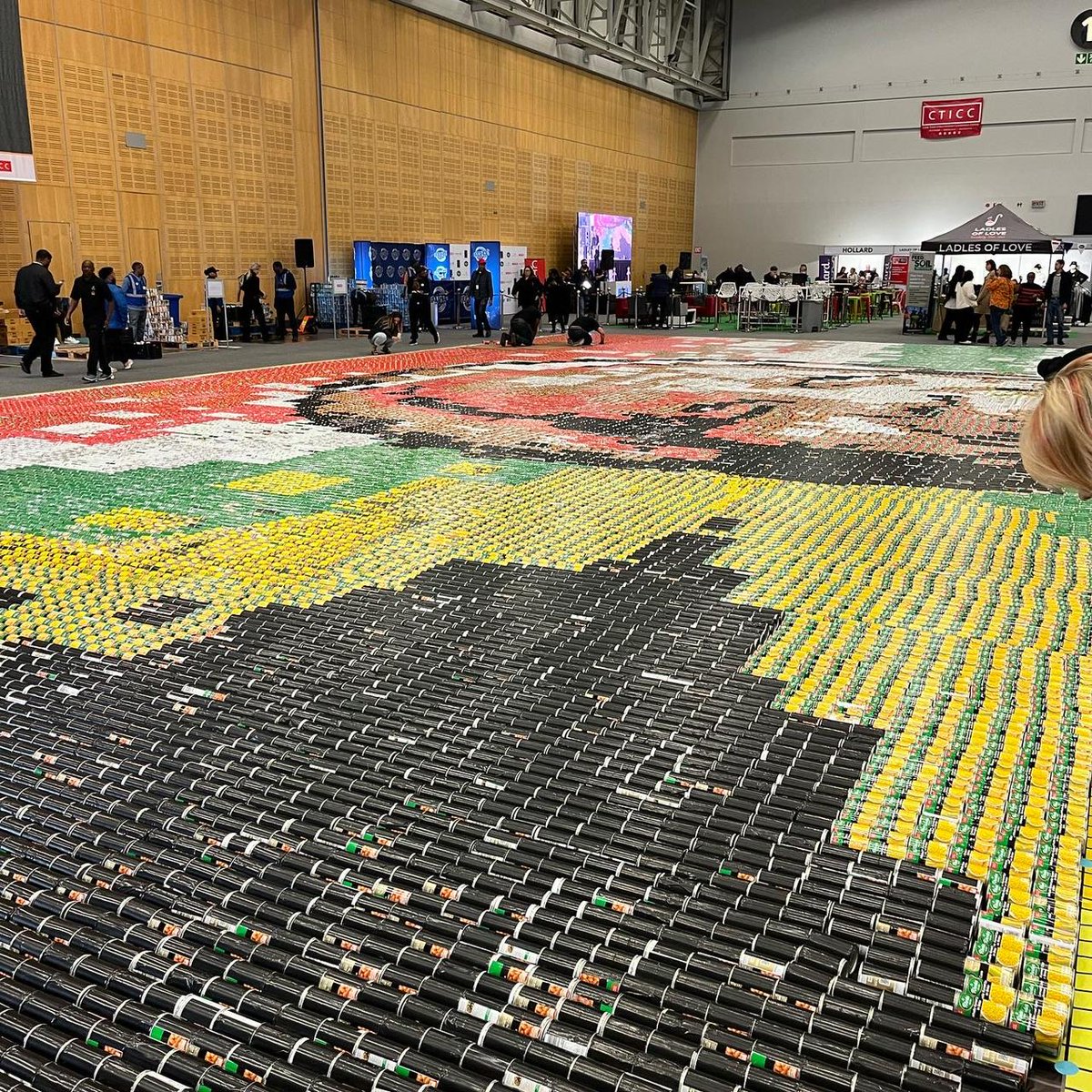LuckyStarSA's tweet photo. Today we worked alongside @LadlesofLove to alleviate hunger and break the world record for the worldβs largest food can mosaic.
Over 58 000 cans will be donated for #mandeladay #ShineOn.
#ladlesoflove #alleviatehunger https://t.co/zfPW41d0K2
