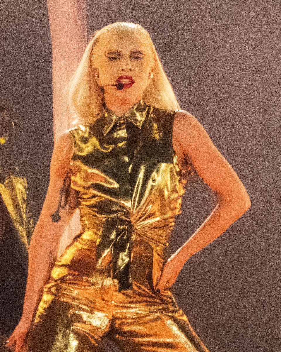 .@ladygaga wearing a custom #AlexanderMcQueen molten metallic gold moiré cropped tailored jacket, sleeveless shirt and wide-legged trousers for the opening night of The #ChromaticaBall. #SeenInMcQueen