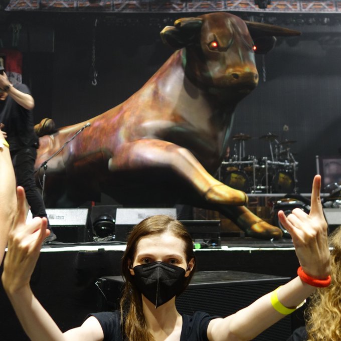 The giant inflatable bull on the stage and me in front of the stage.