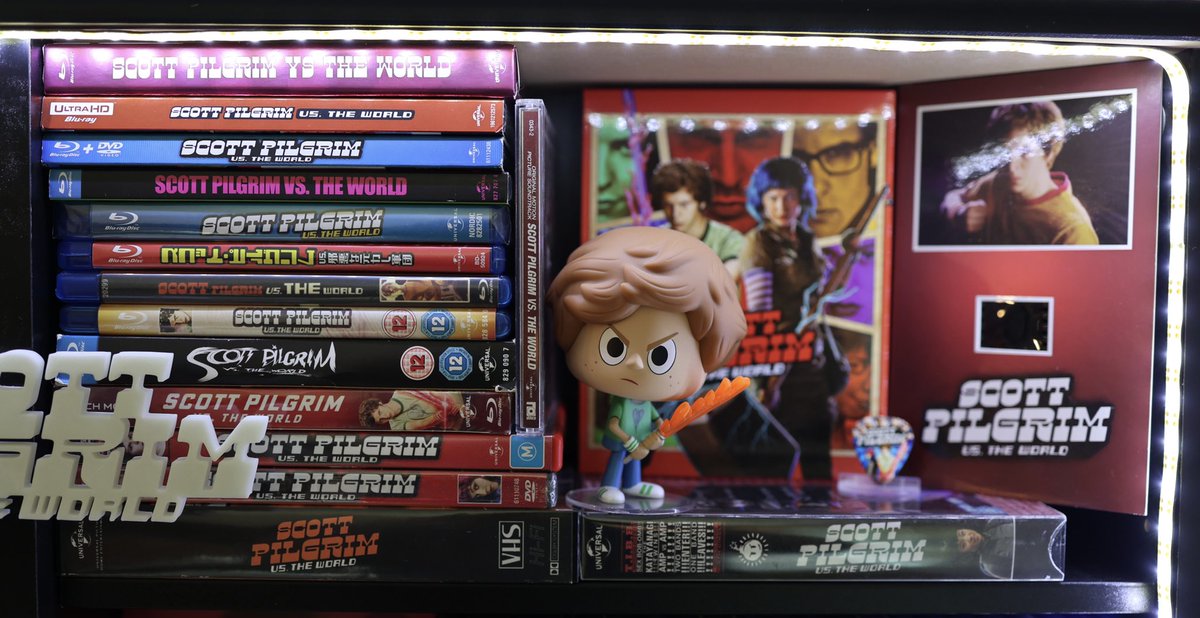 TheCollekterYT's tweet photo. My MASSIVE Scott Pilgrim Vs. The World Movie Collection! 28 different copies of the film + little extras! Just got in this AWESOME Senitype - a 35mm film frame of the movie!🤘🎸 #ScottPilgrim #ScottPilgrimVsTheWorld #EdgarWright #Movie https://t.co/RiiE2wnDhe