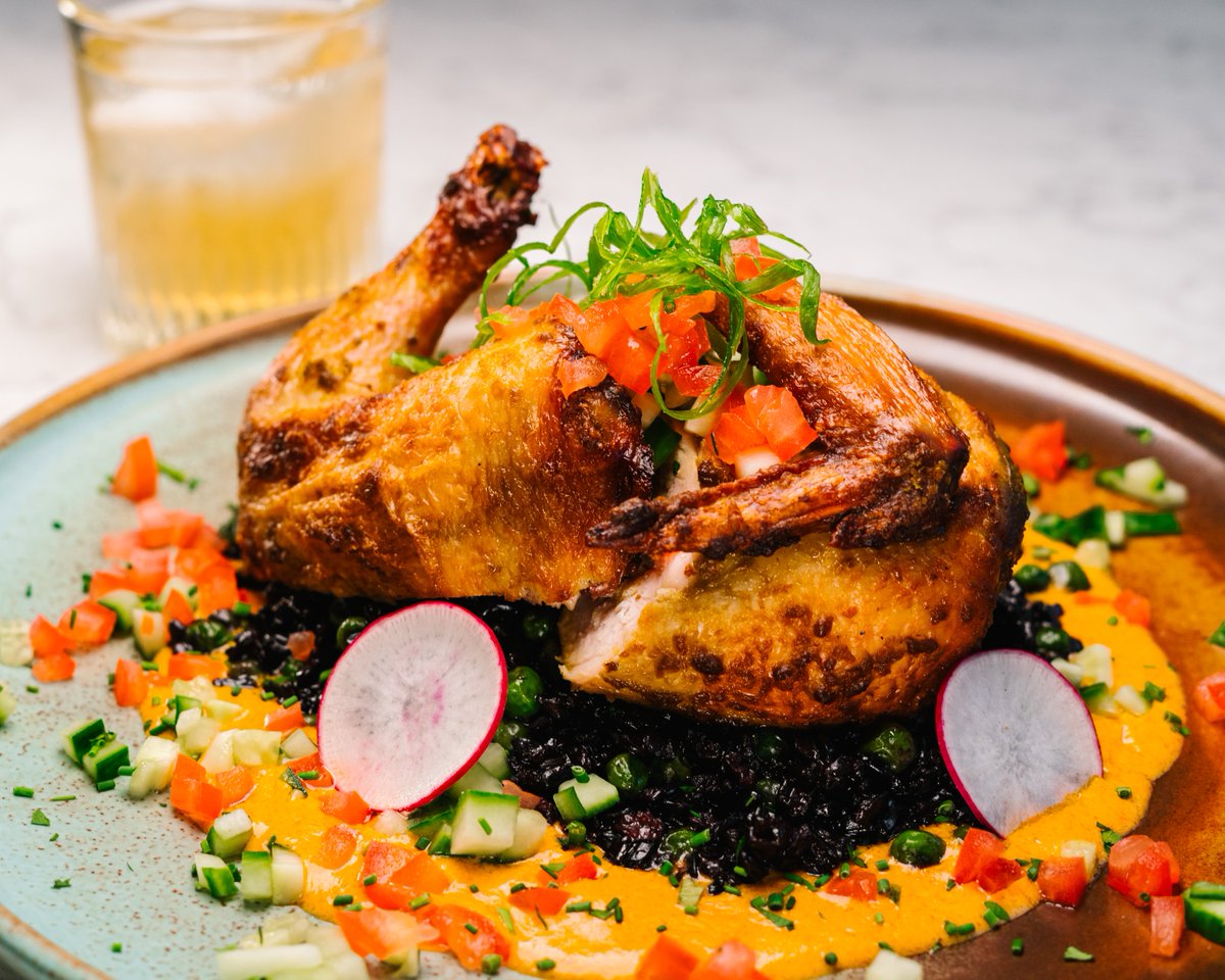 The Peri Peri hen ialmost looks too good to eat.  
Half Cornish hen, buttered forbidden rice and peas, diced cucumber and tomato, and sriracha cream. 

#downtownhalifax #dinelocal #lotsix #discoverhalifax #glutenfreehalifax