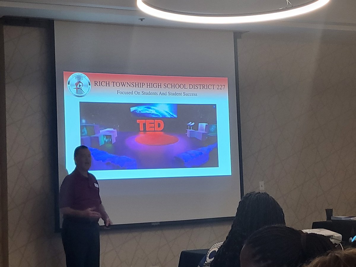 LinneaSGarrett's tweet photo. Some fun times at our retreat today! @TKoutavas_D227 presenting his TED talk and our annual RTHS rock, paper scissors competition! #richinstudentsuccess https://t.co/Jsb8GXeOax