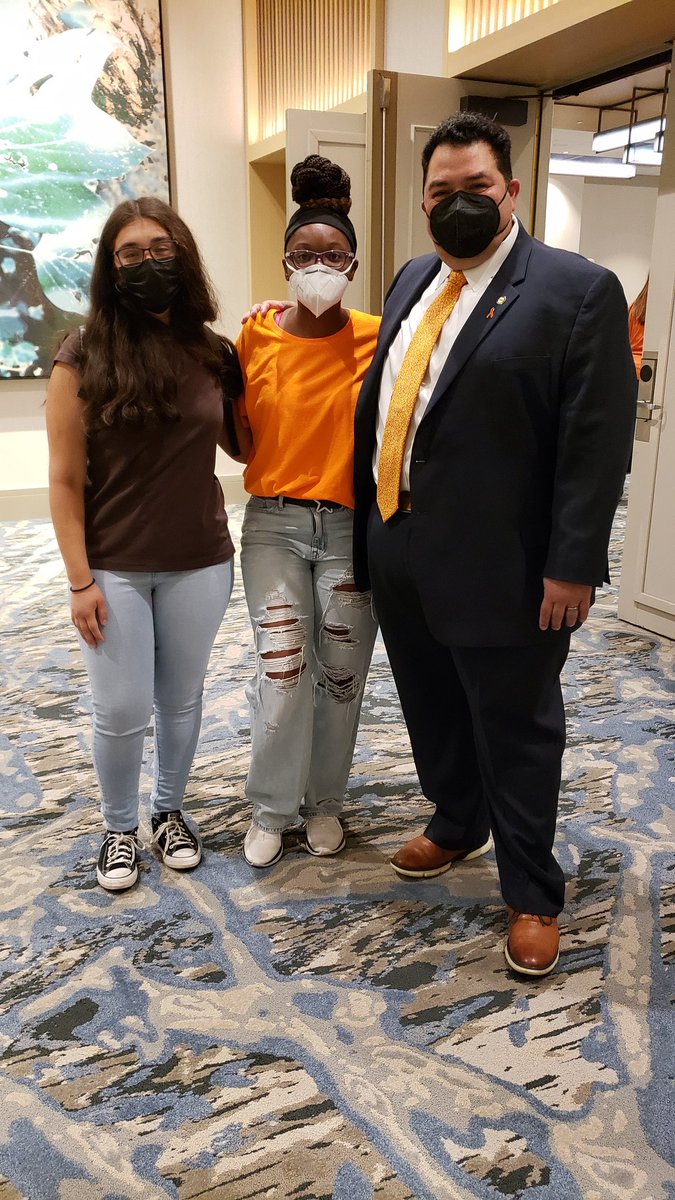 NEA Secretary-Treasure Noel Candelaria &amp; daughter stop by The Texas Caucus, family, to welcome us to the 2022 NEA RA!

We wear orange to fight for a future free from gun violence.

#EndGunViolence 

<a href="/NoelCandelaria/">Noel Candelaria ✊🏼🟧</a> 
<a href="/txstateteachers/">TSTA/NEA</a>