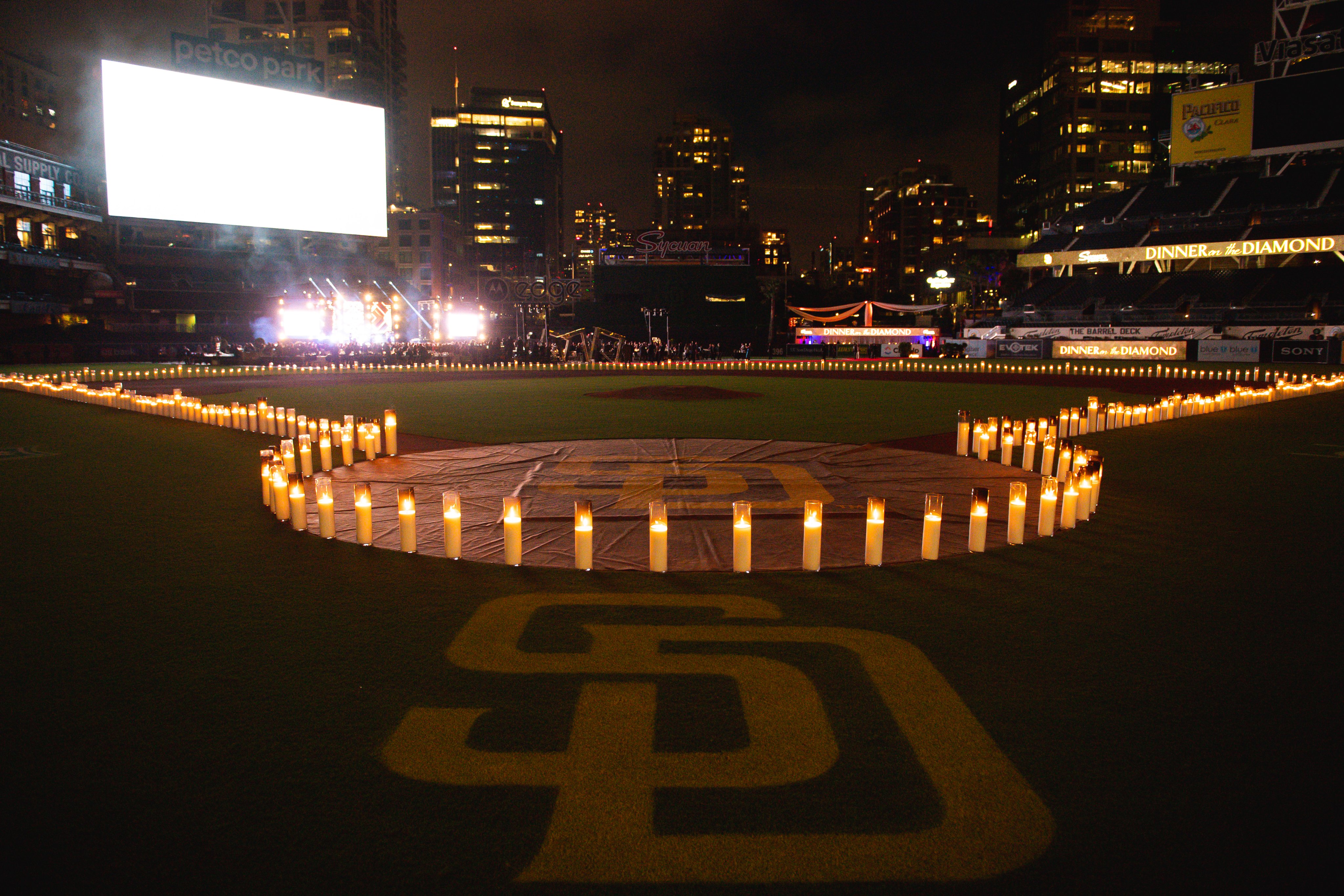 Petco Park from behind home plate with the infield outlined with candles.