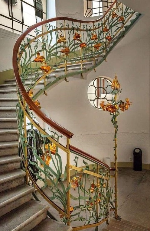 artinsociety's tweet photo. Enjoying this Art Nouveau winding staircase decorated with metal flowers and vines, designed by architect Ede Magyar, at Reök Palace in Szeged, Hungary (1907) https://t.co/jzEZbSBr4V